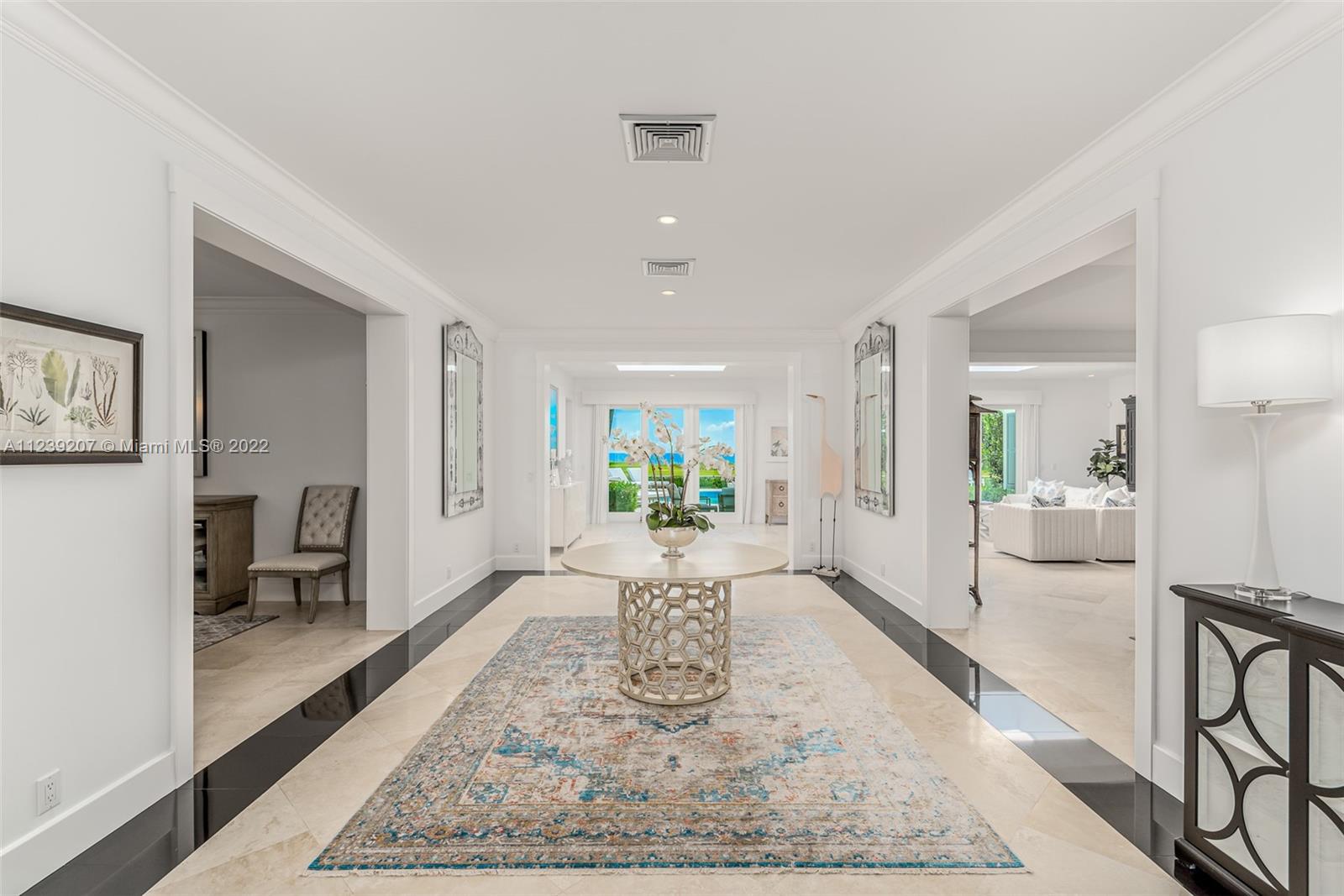 25 South Beach Road Hobe Sound, FL 33455 - Photo 9 of 34 a living room with furniture rug and a table