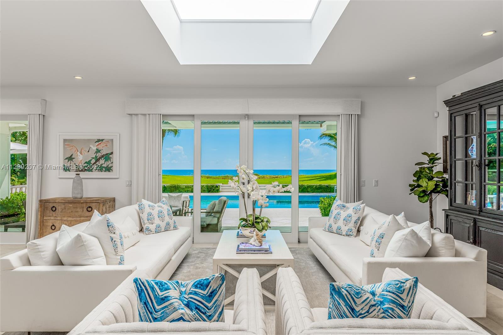 25 South Beach Road Hobe Sound, FL 33455 - Photo 10 of 34 a living room with furniture and a large window