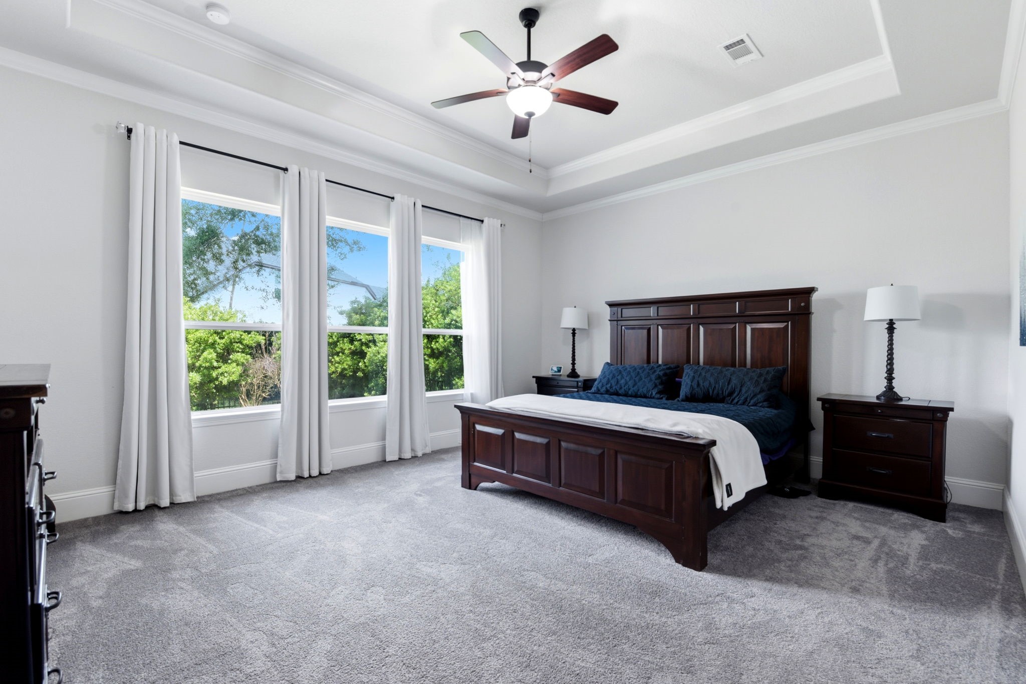 10062 South Goshawk Trail Conroe, TX 77385 - Photo 21 of 43 a bedroom with a bed and a large window