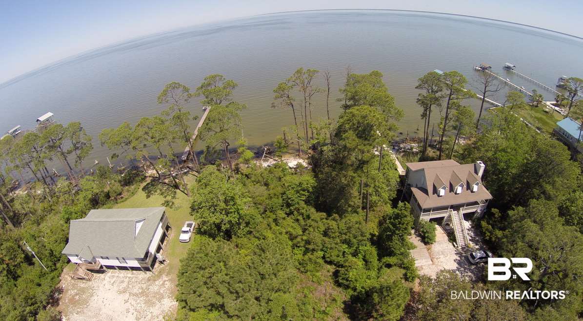 9543 Ft Morgan Road Gulf Shores, AL 36542 - Photo 11 of 28 eastern and western neighbor's houses flanking lot