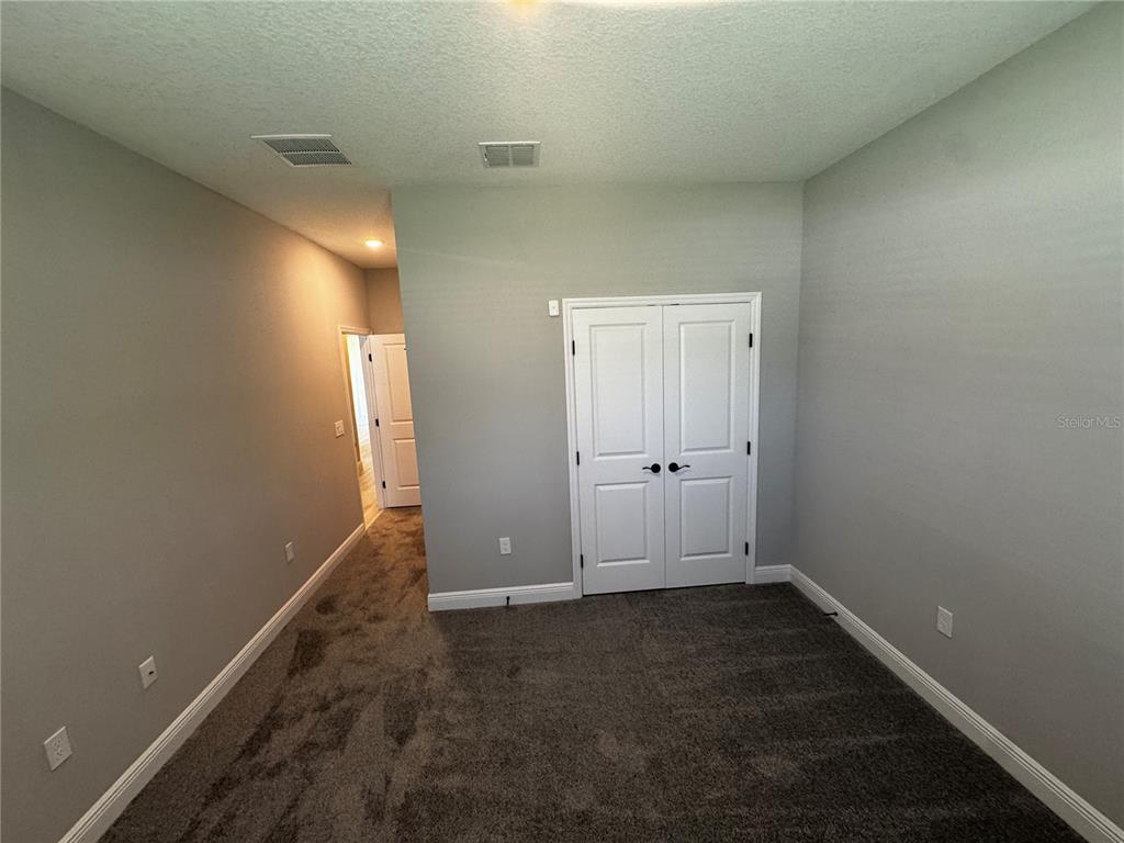 13101 Southwest 72nd Terrace Road Ocala, FL 34473 - Photo 13 of 18 an empty room with closet
