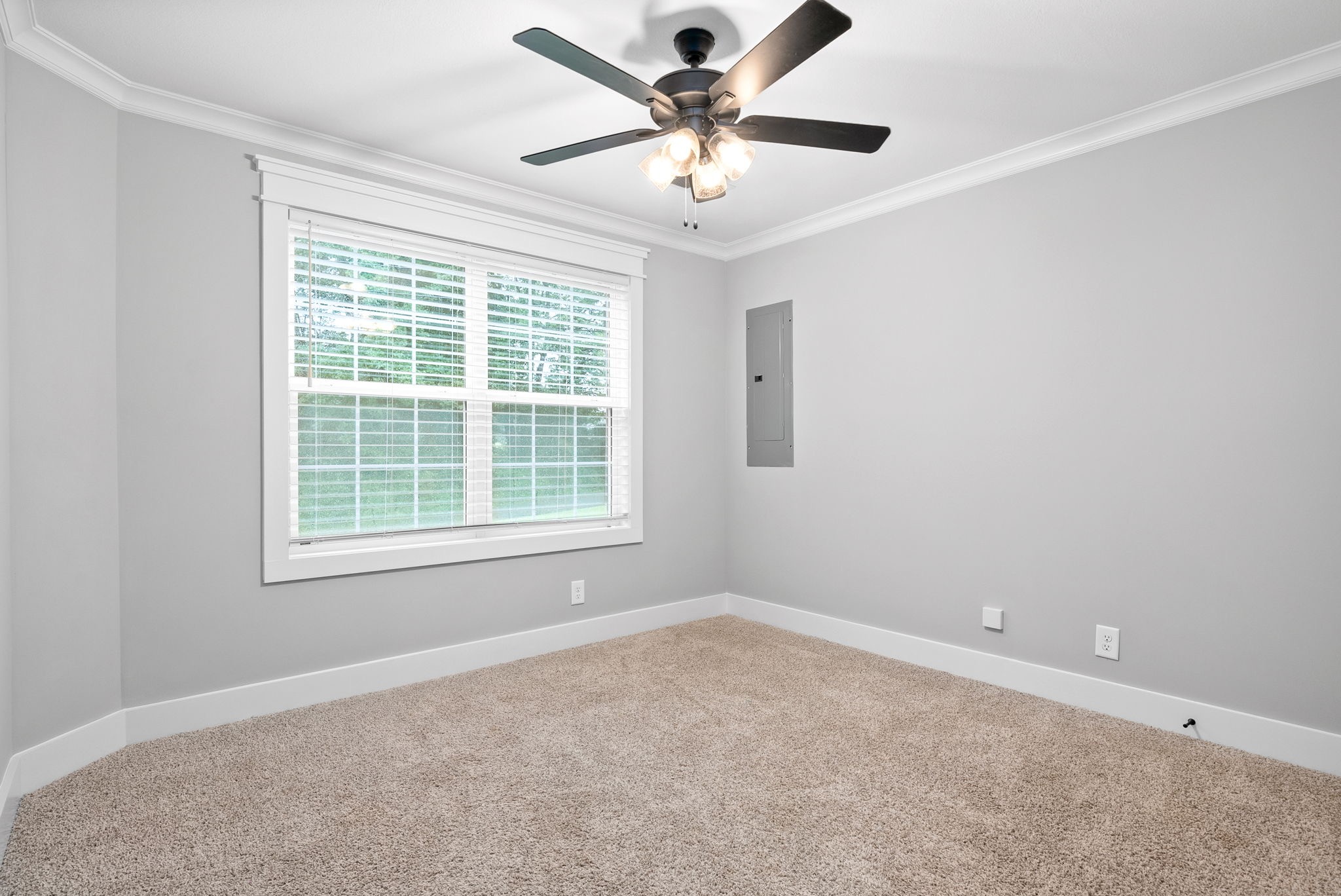 1385 L Bumpus Road Clarksville, TN 37040 - Photo 14 of 28 an empty room with a window and a fan