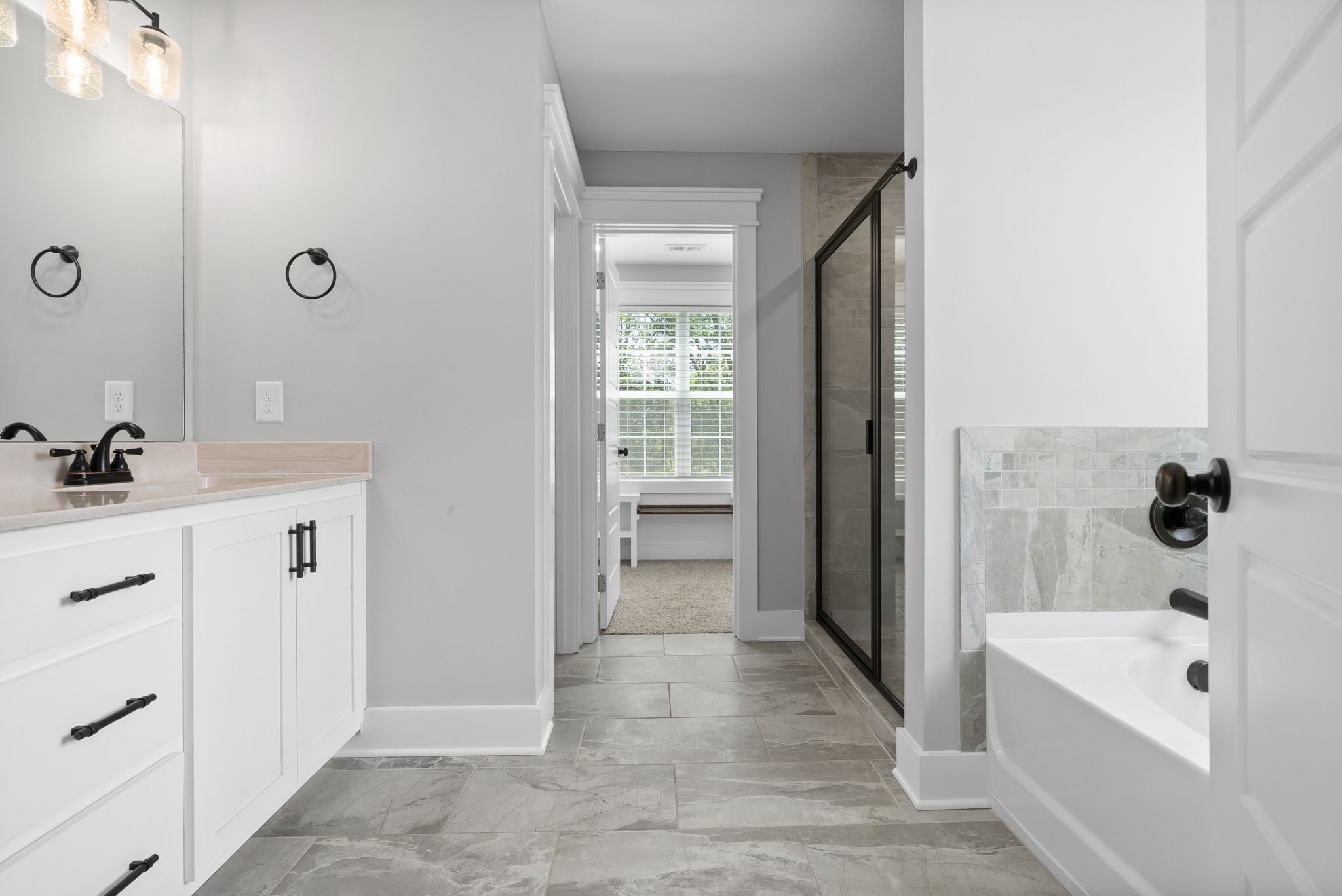 1385 L Bumpus Road Clarksville, TN 37040 - Photo 18 of 28 a bathroom with a tub shower sink and mirror