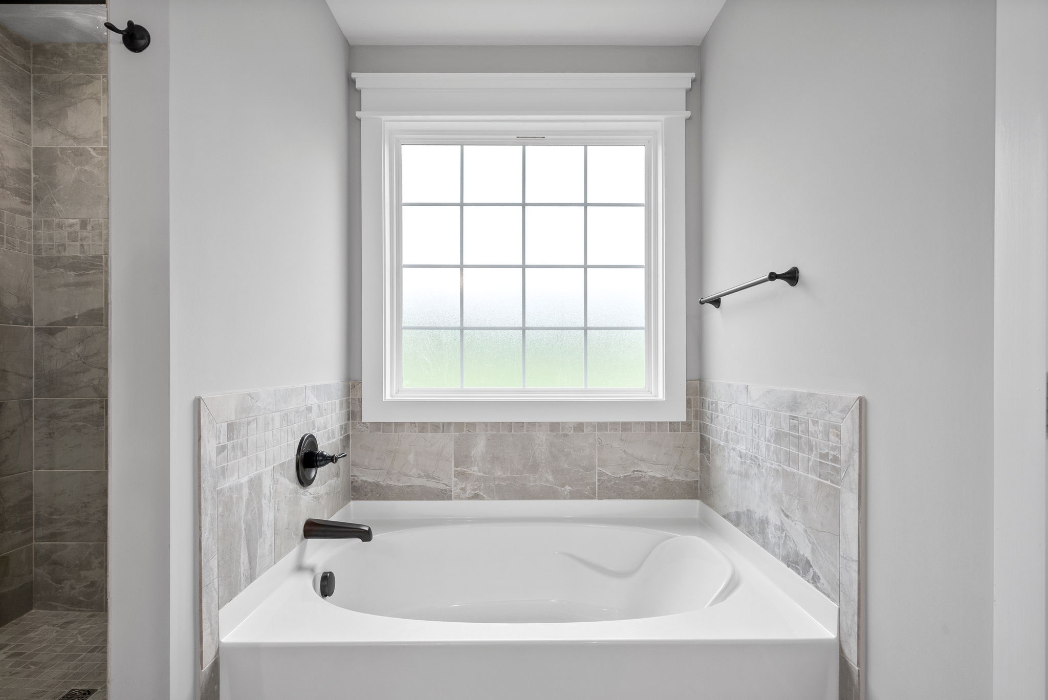 1385 L Bumpus Road Clarksville, TN 37040 - Photo 21 of 28 a white bath tub sitting next to a window