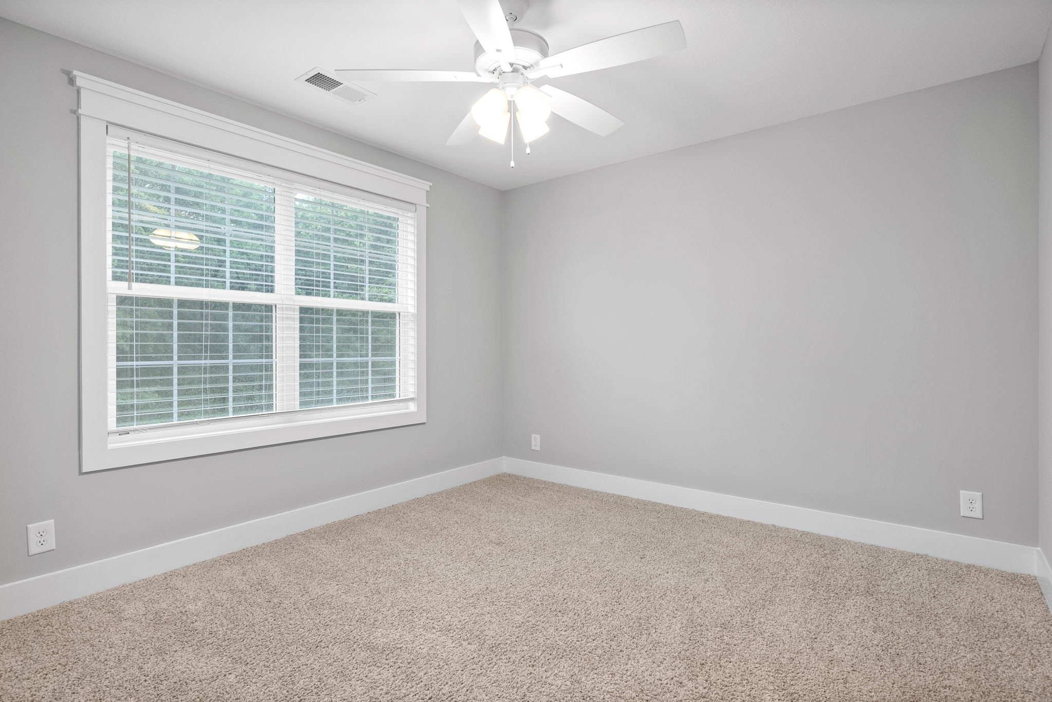 1385 L Bumpus Road Clarksville, TN 37040 - Photo 24 of 28 an empty room with a window and a fan