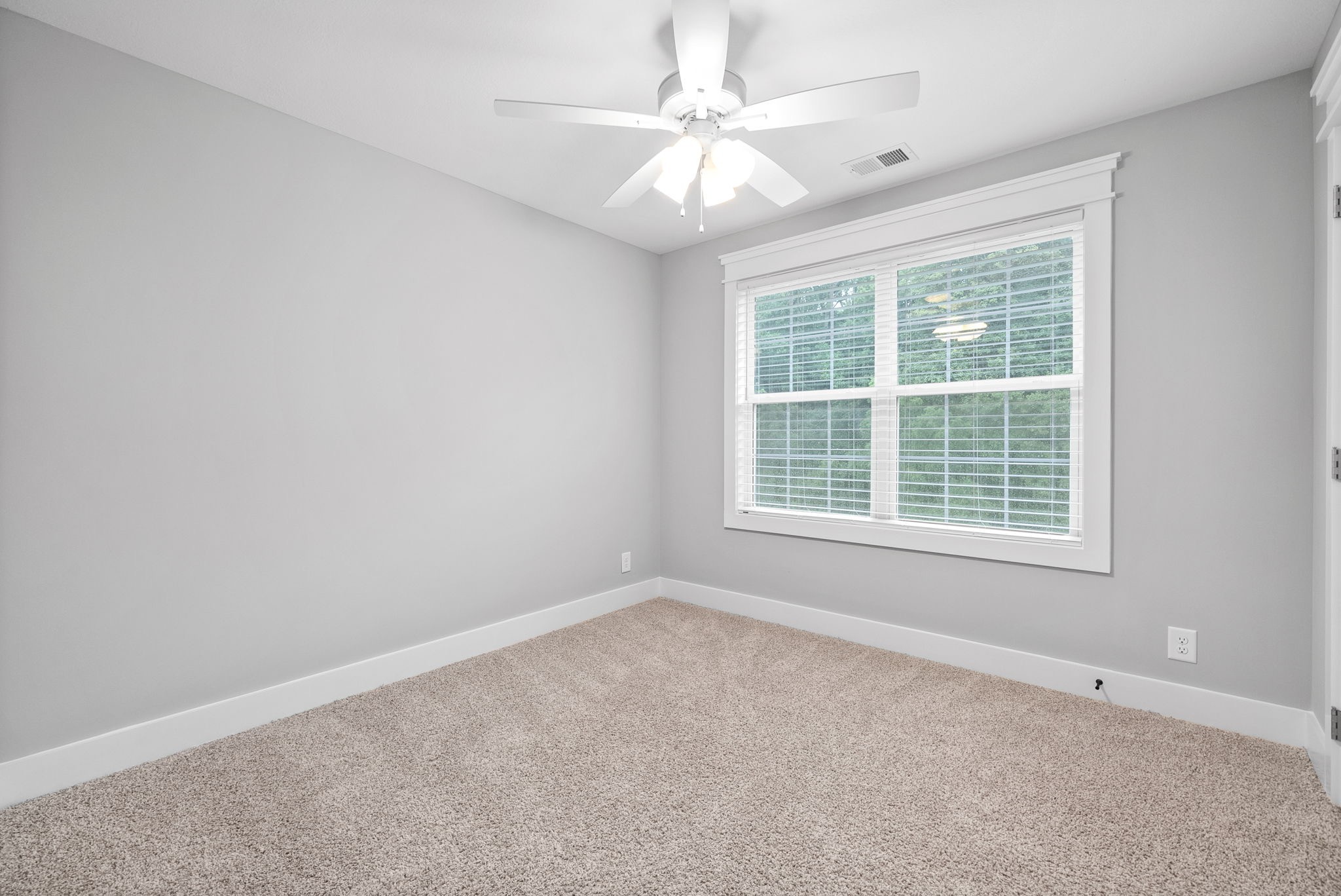 1385 L Bumpus Road Clarksville, TN 37040 - Photo 26 of 28 an empty room with a window and a fan