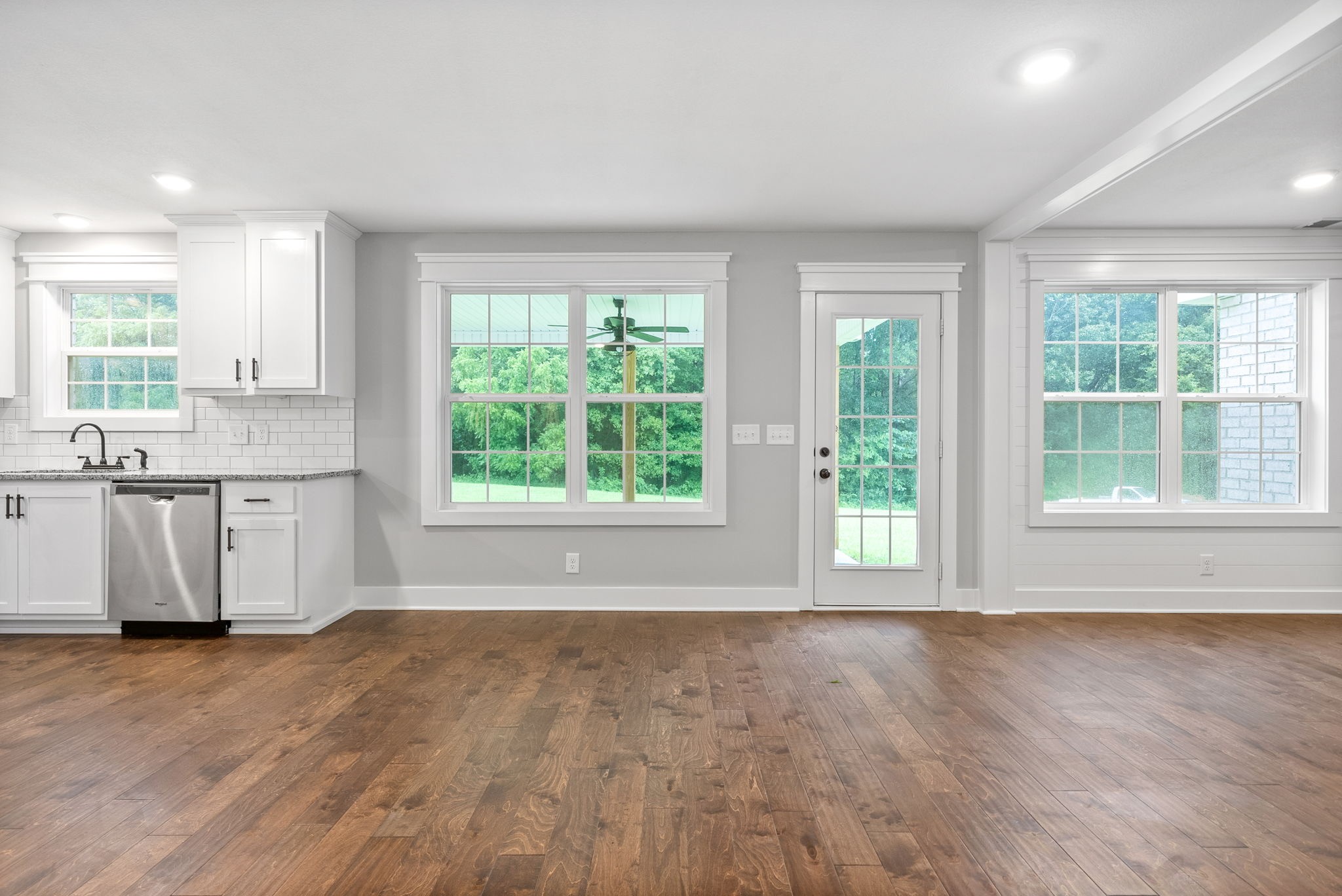 1385 L Bumpus Road Clarksville, TN 37040 - Photo 4 of 28 a view of a kitchen with a sink wooden cabinets and a window