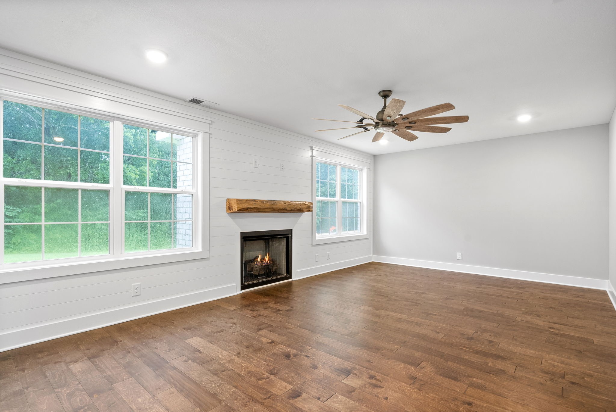 1385 L Bumpus Road Clarksville, TN 37040 - Photo 6 of 28 a view of an empty room with a fireplace and a window