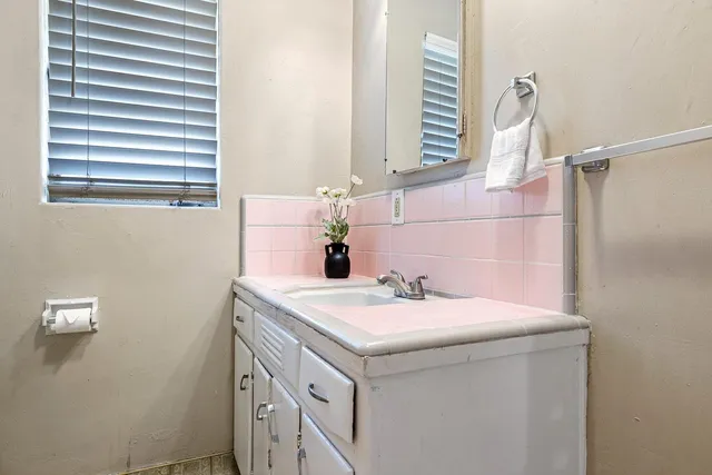 a view of a room with a wooden floor