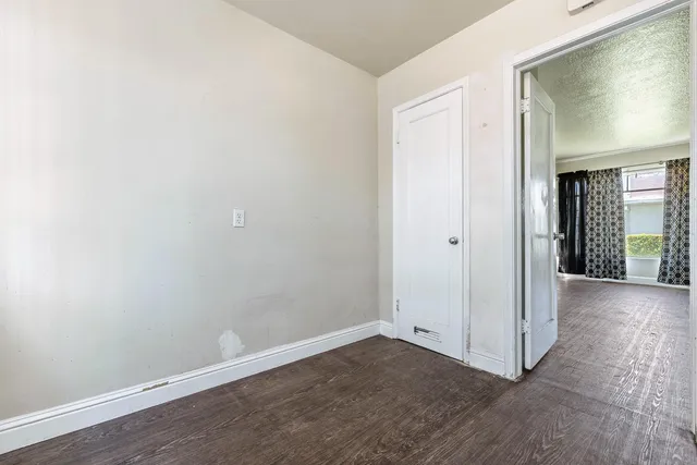 a kitchen with a refrigerator and a stove top oven