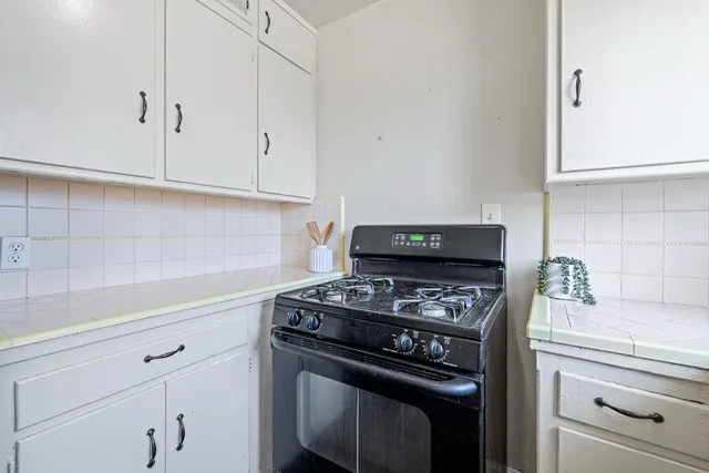 an aerial view of a house with a garden and yard