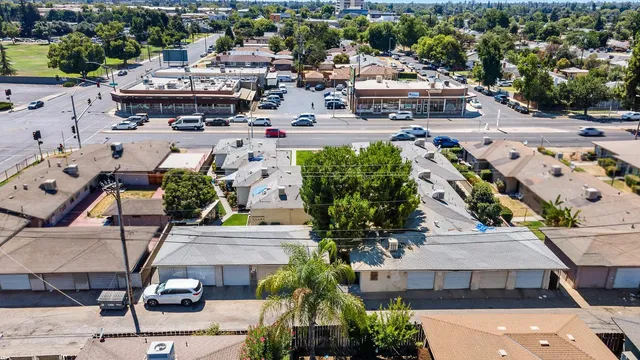 an aerial view of a house with a garden and plants