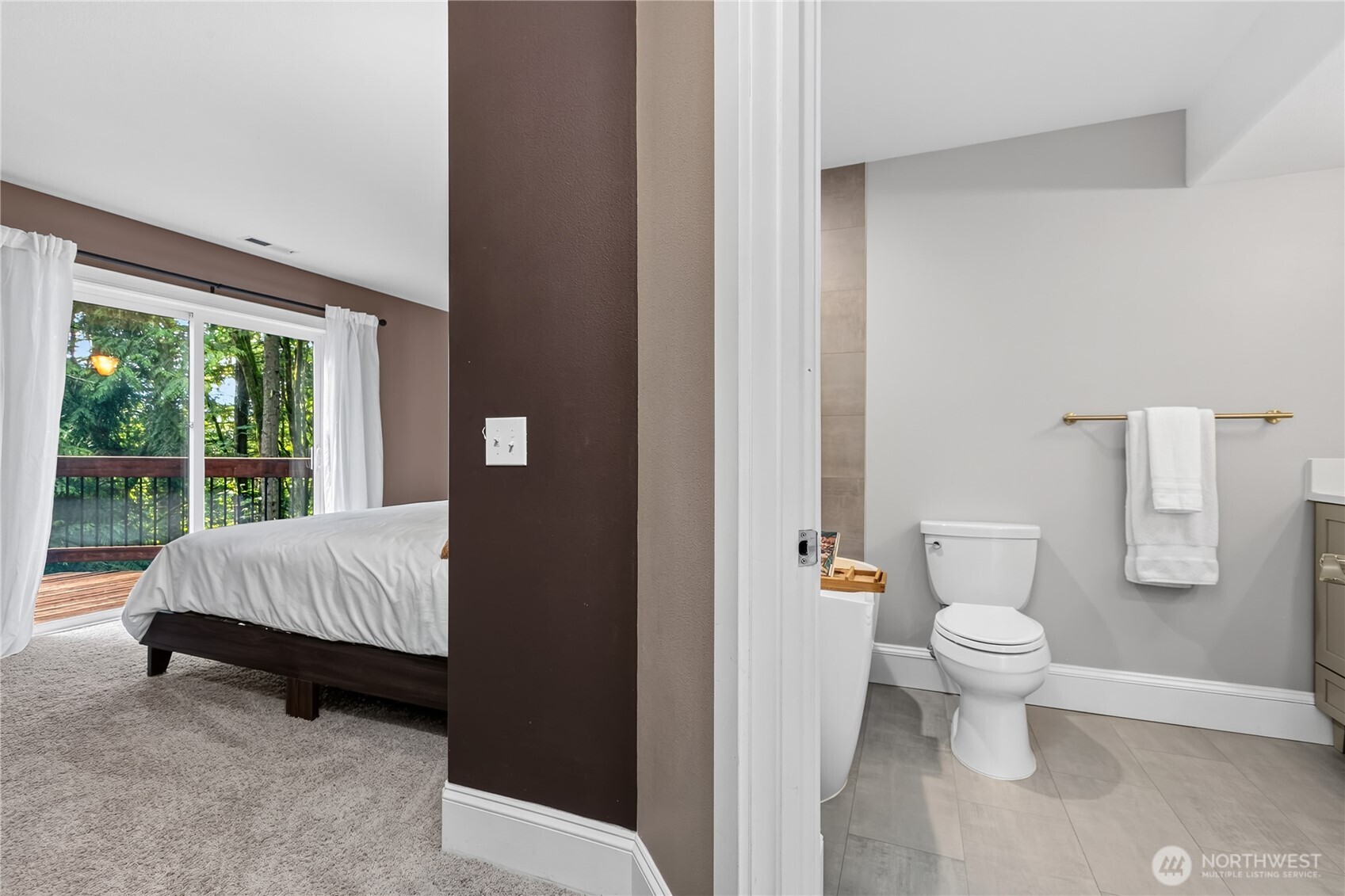 45 Cascade Lane Bellingham, WA 98229 - Photo 22 of 40 a spacious bedroom with a bed and glass window