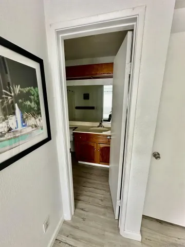 a kitchen with a sink and a refrigerator