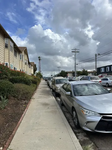 a view of parking area with parked cars