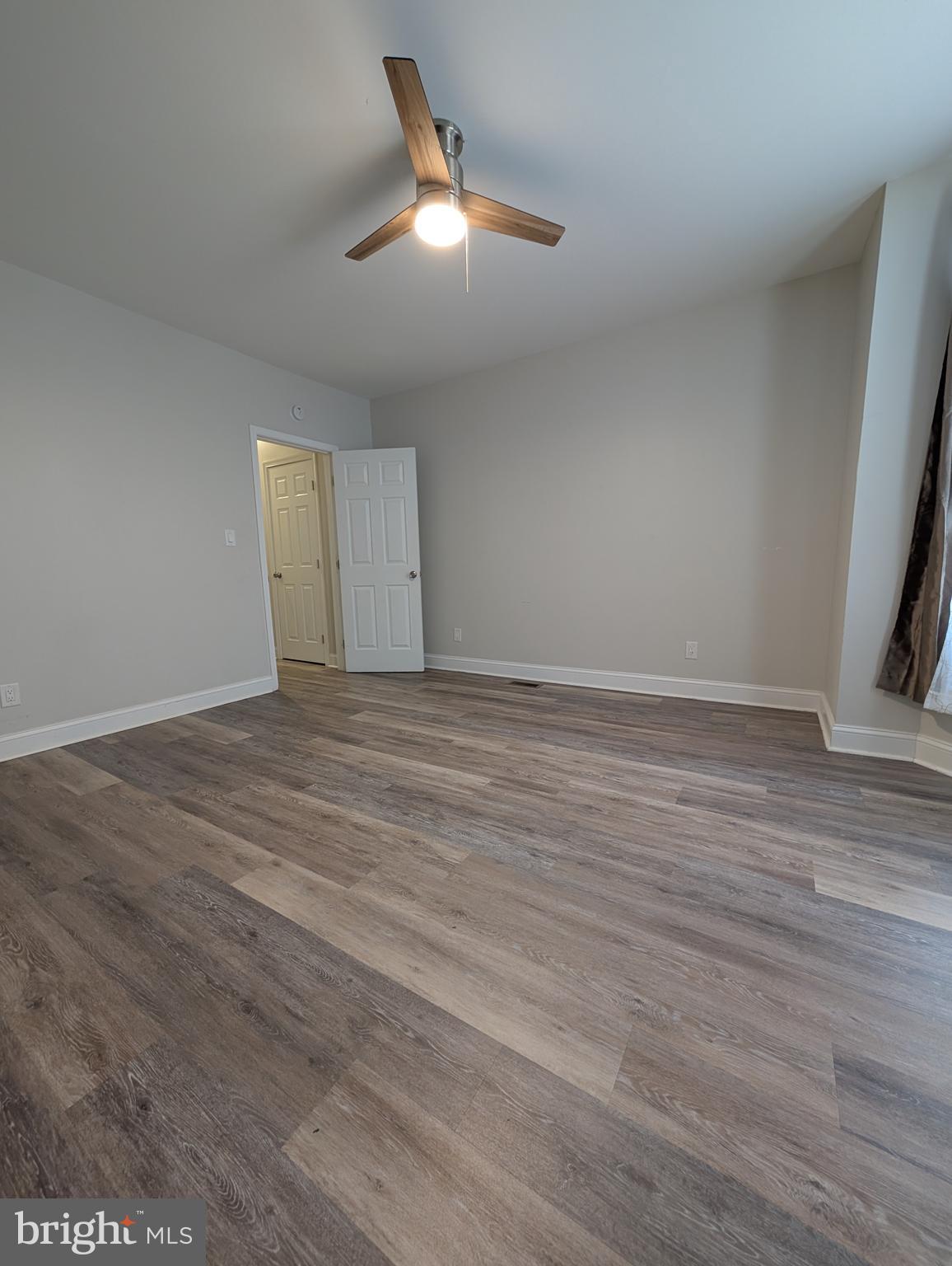 1327 North Wanamaker Street Philadelphia, PA 19131 - Photo 8 of 14 a view of an empty room with wooden floor