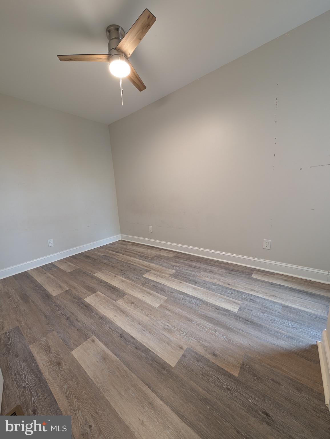1327 North Wanamaker Street Philadelphia, PA 19131 - Photo 10 of 14 a view of a room with a ceiling fan and a window