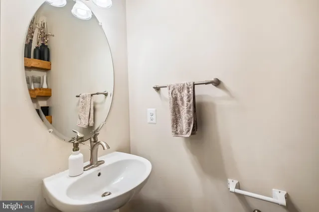 a bathroom with a sink and mirror