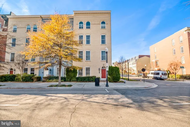 a view of a street with a building in the background