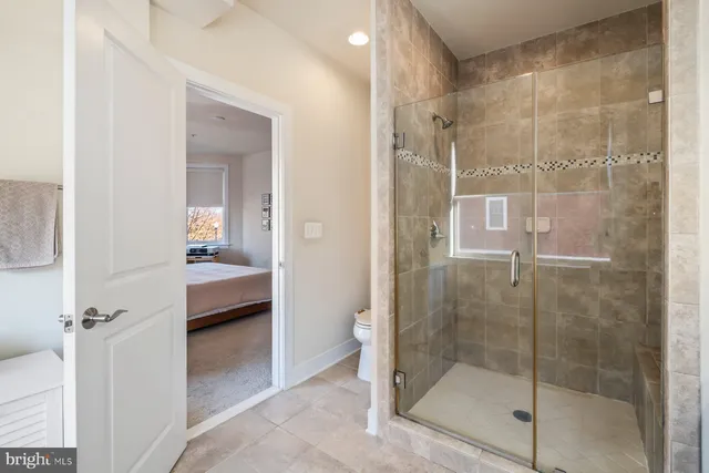 a bathroom with a shower and a sink