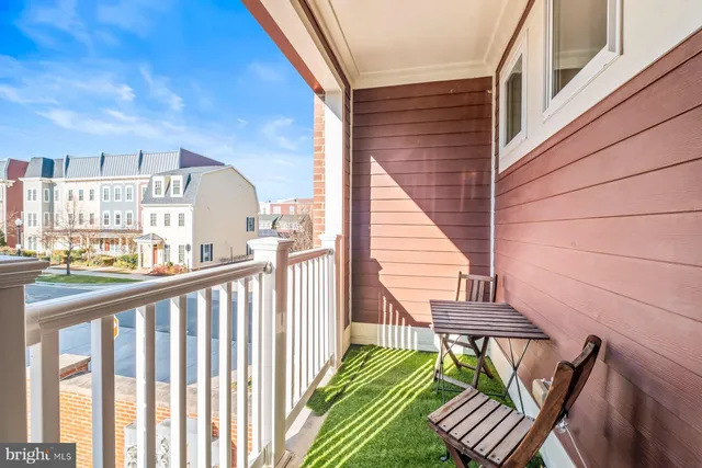 a view of a balcony with chairs