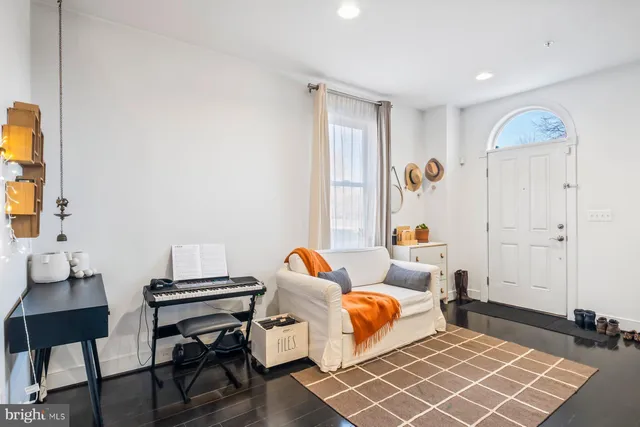 a bedroom with furniture and a window