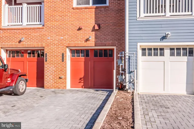 a front view of a house with parking space