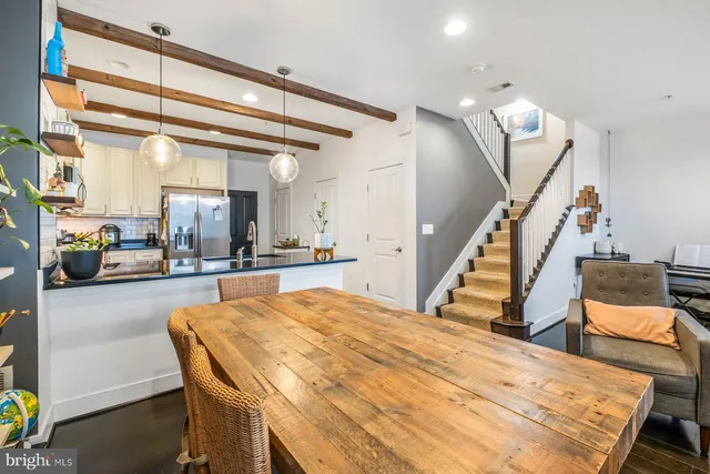 a view of kitchen and dining room with wooden floor