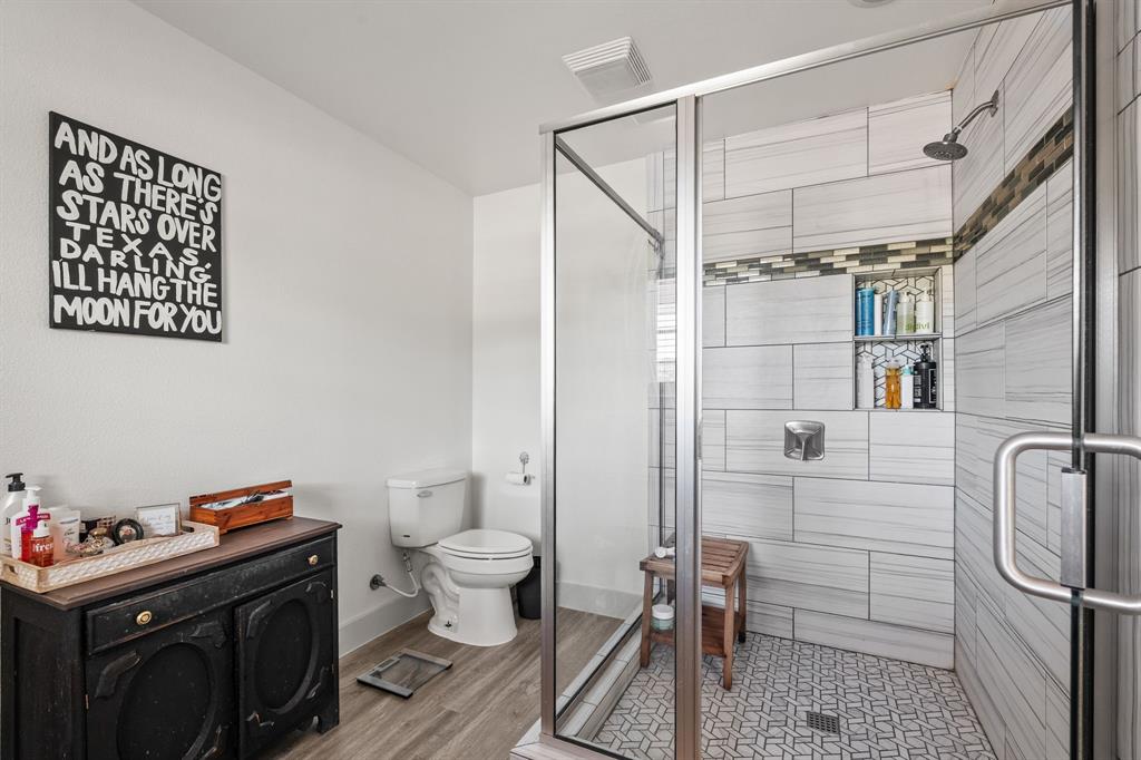 9778 Highway 11 Whitewright, TX 75491 - Photo 14 of 37 a bathroom with a sink toilet and shower