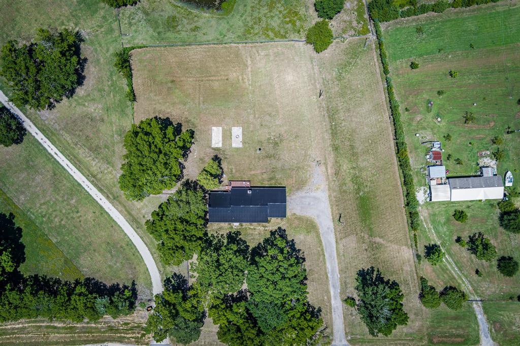 9778 Highway 11 Whitewright, TX 75491 - Photo 2 of 37 an aerial view of a house
