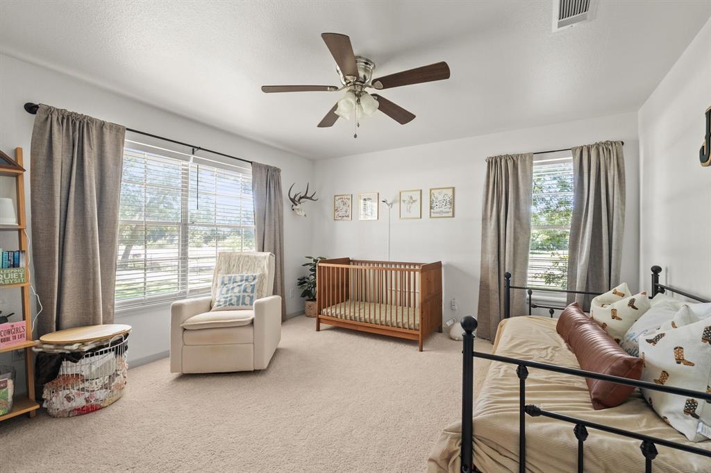 9778 Highway 11 Whitewright, TX 75491 - Photo 22 of 37 a living room with furniture and windows