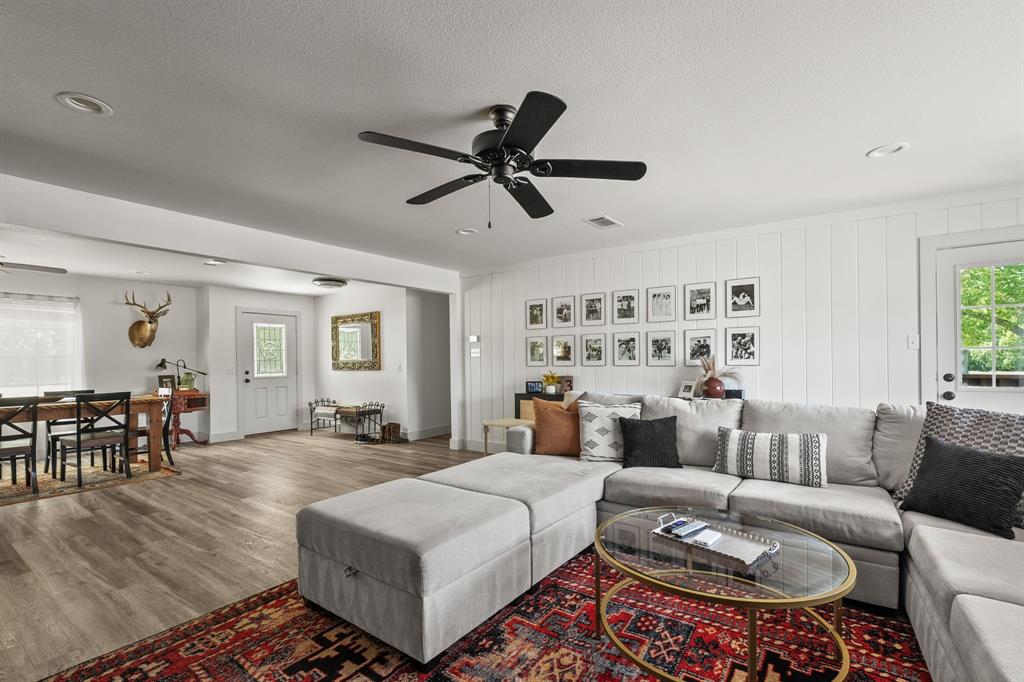 9778 Highway 11 Whitewright, TX 75491 - Photo 26 of 37 a living room with furniture and wooden floor