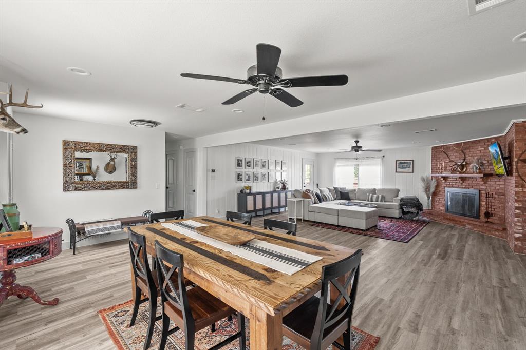 9778 Highway 11 Whitewright, TX 75491 - Photo 29 of 37 a view of a dining room with furniture and wooden floor