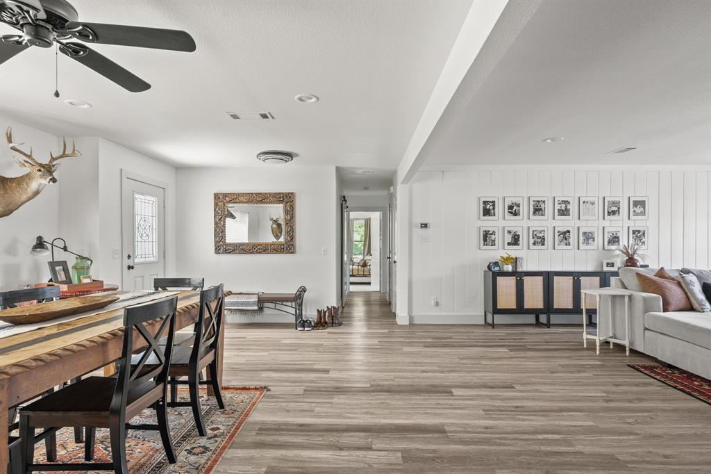 9778 Highway 11 Whitewright, TX 75491 - Photo 30 of 37 a view of a dining room with furniture and a chandelier