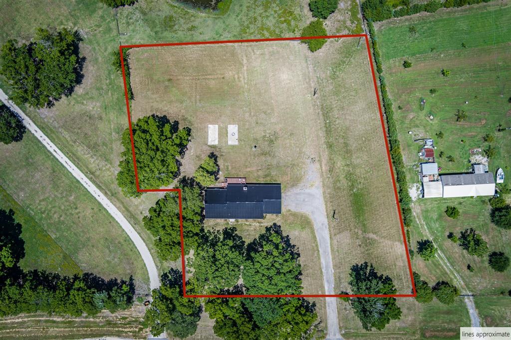 9778 Highway 11 Whitewright, TX 75491 - Photo 3 of 37 an aerial view of a house