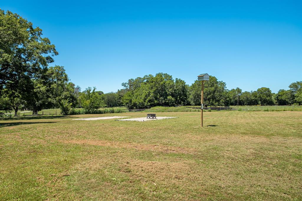 9778 Highway 11 Whitewright, TX 75491 - Photo 34 of 37 a view of a lake and trees in the background