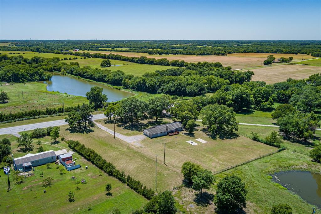 9778 Highway 11 Whitewright, TX 75491 - Photo 4 of 37 an aerial view of a houses with outdoor space and river view