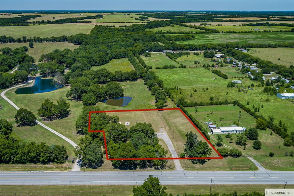 9778 Highway 11 Whitewright, TX 75491 - Photo 8 of 37 an aerial view of a residential houses with outdoor space and street view