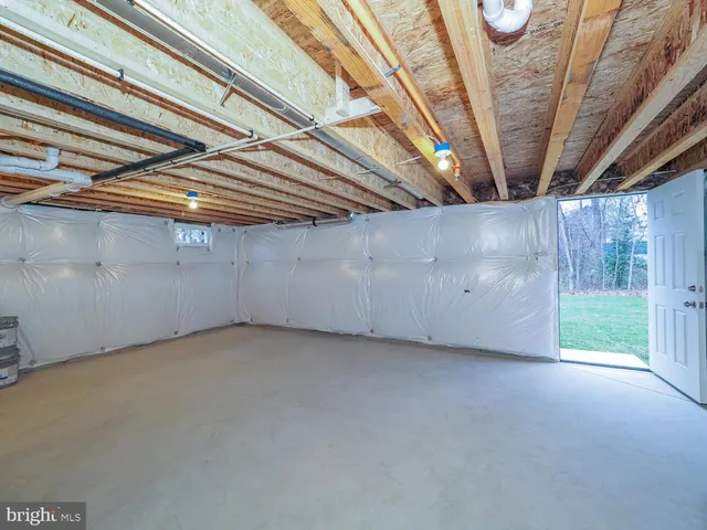 a view of storage and utility room with a window