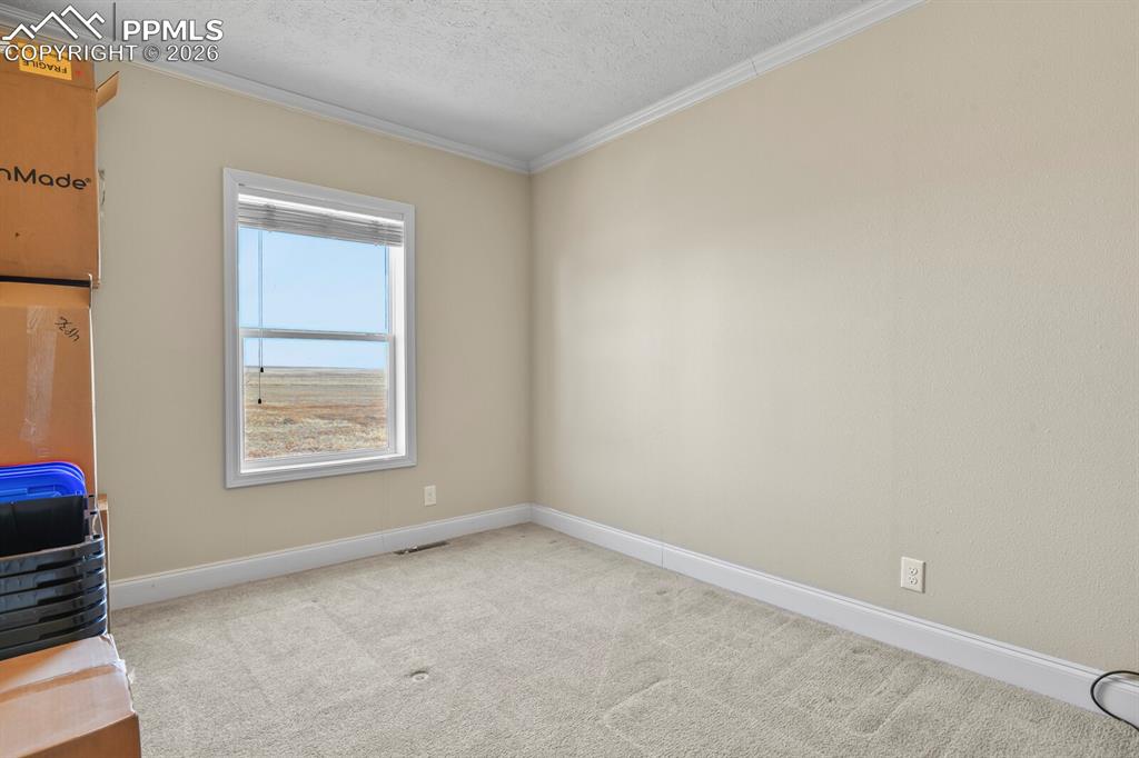 5895 Bar 10 Road Colorado Springs, CO 80928 - Photo 16 of 50 an empty room with a window