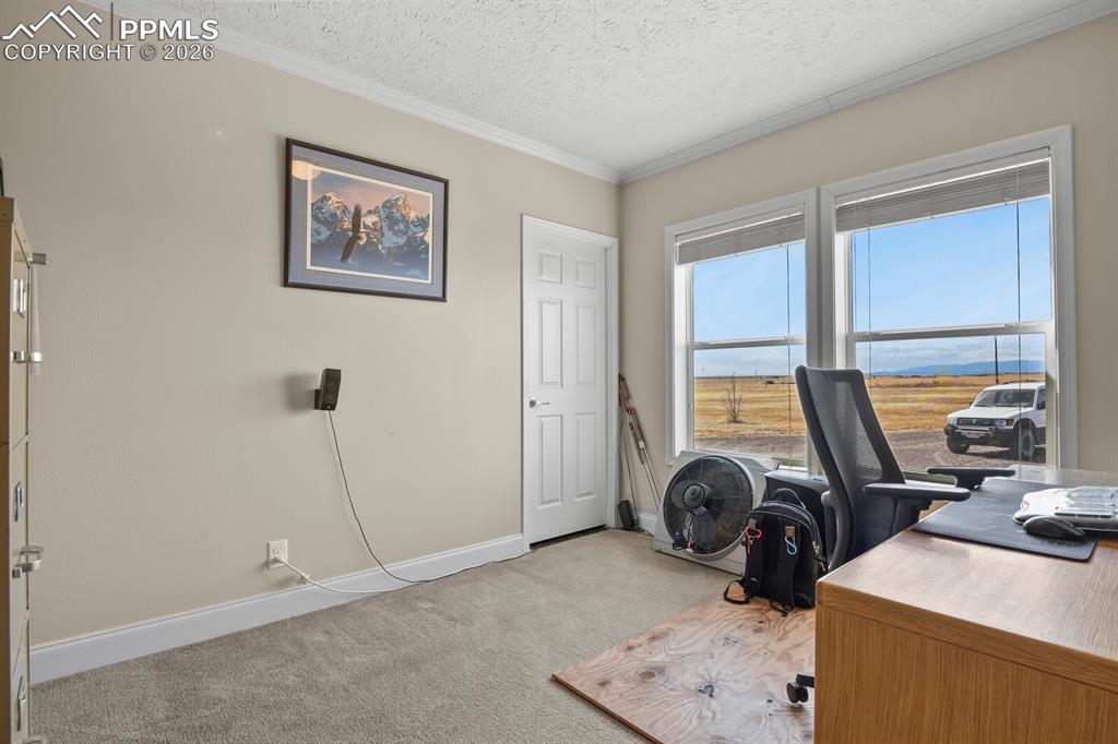 5895 Bar 10 Road Colorado Springs, CO 80928 - Photo 18 of 50 a view of a workspace with a window