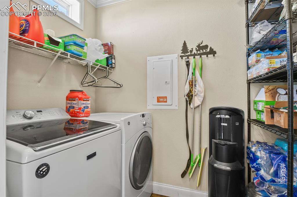 5895 Bar 10 Road Colorado Springs, CO 80928 - Photo 21 of 50 a utility room with dryer and washer