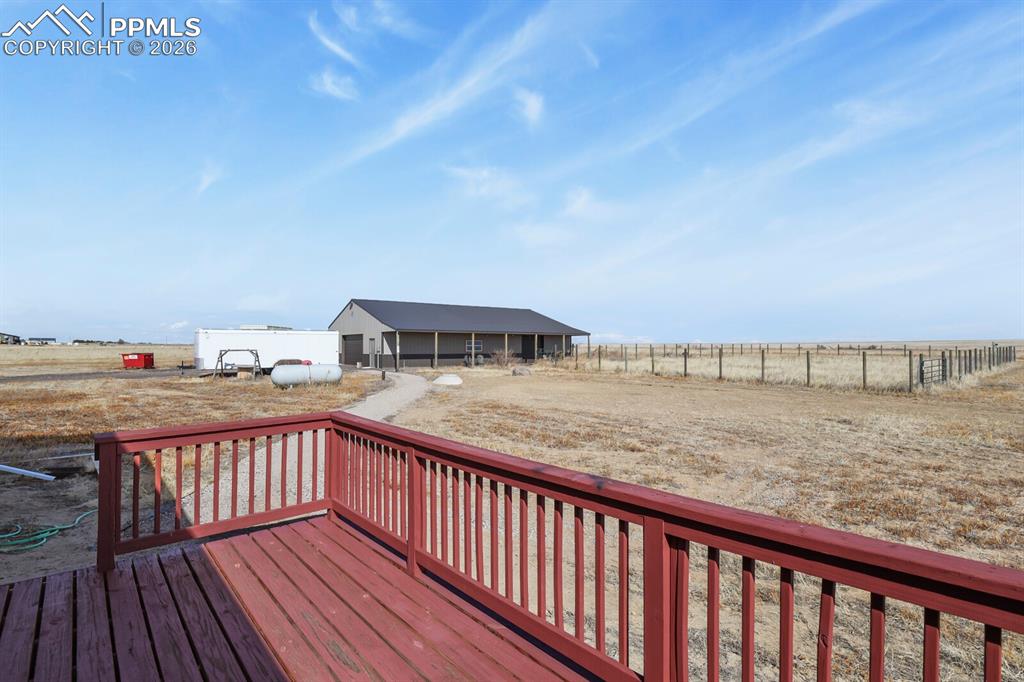 5895 Bar 10 Road Colorado Springs, CO 80928 - Photo 22 of 50 a view of balcony with wooden floor