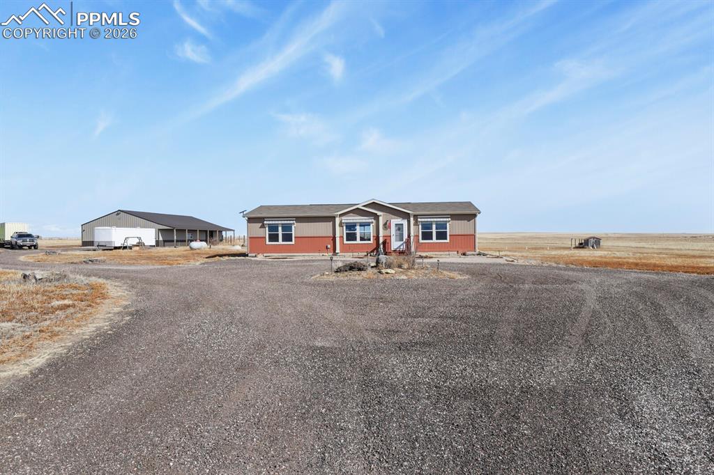 5895 Bar 10 Road Colorado Springs, CO 80928 - Photo 31 of 50 a view of house with outdoor space