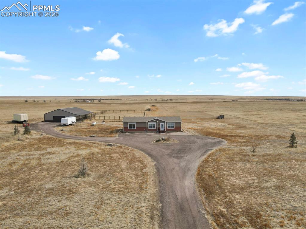 5895 Bar 10 Road Colorado Springs, CO 80928 - Photo 37 of 50 a view of a room with an outdoor space