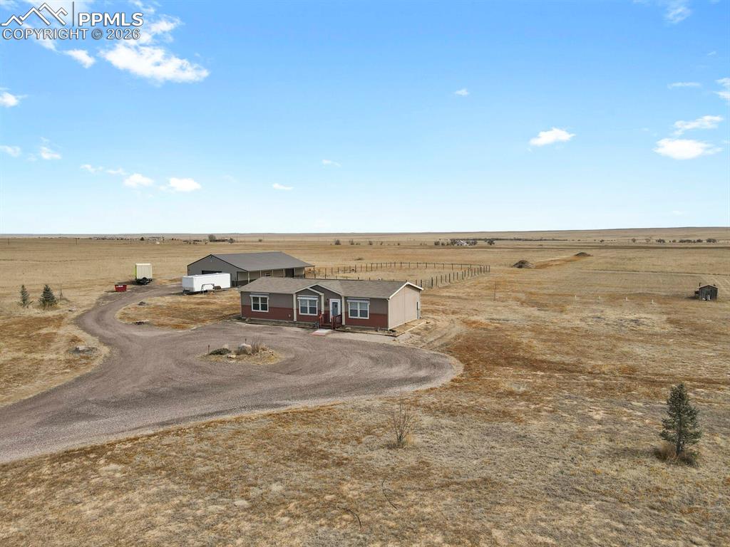 5895 Bar 10 Road Colorado Springs, CO 80928 - Photo 38 of 50 a view of a room with an ocean view