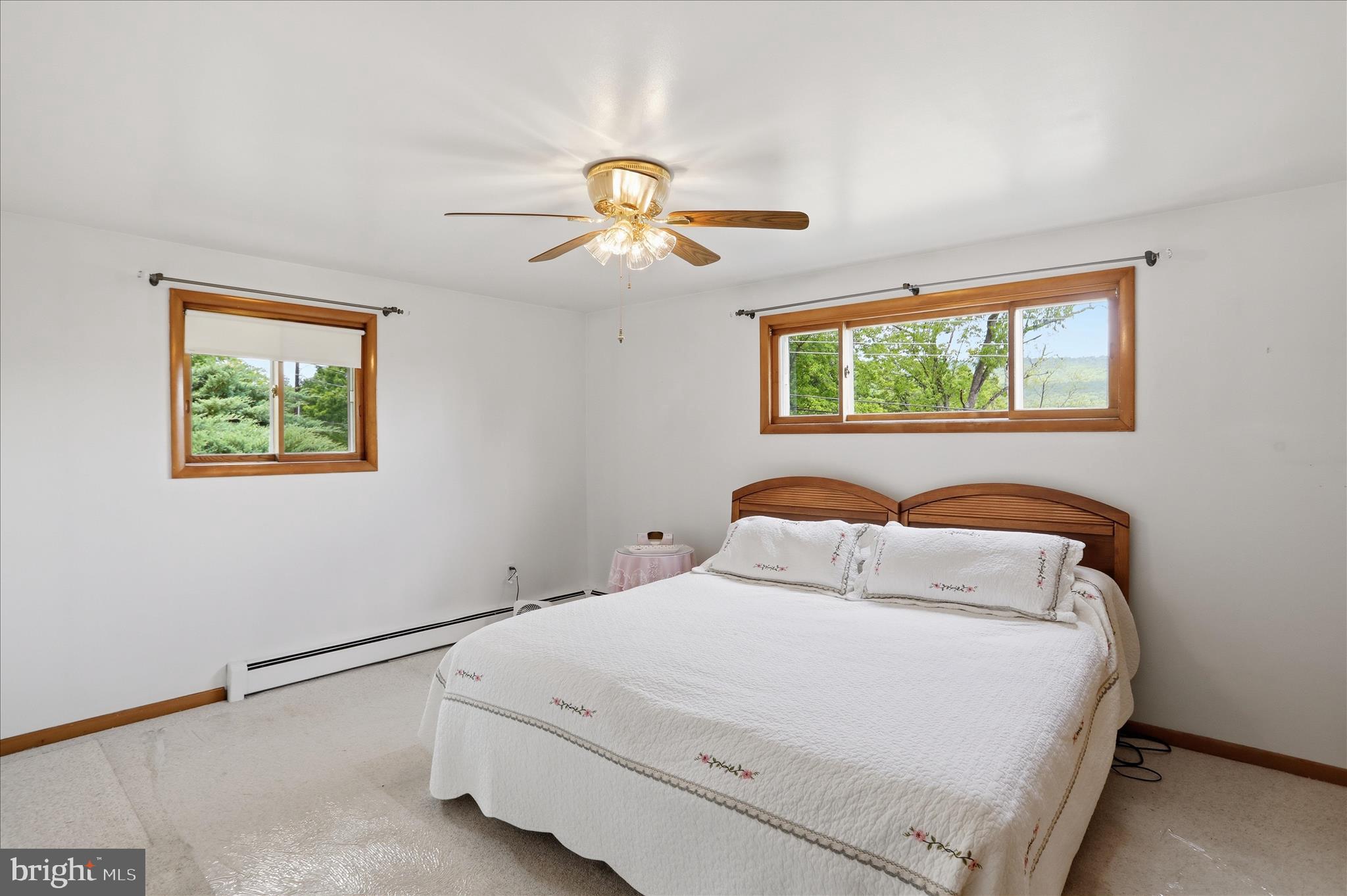 199 Buser Street Ridgeley, WV 26753 - Photo 21 of 49 a bedroom with a bed and a window