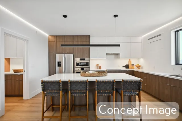 a kitchen that has a table and chairs in it