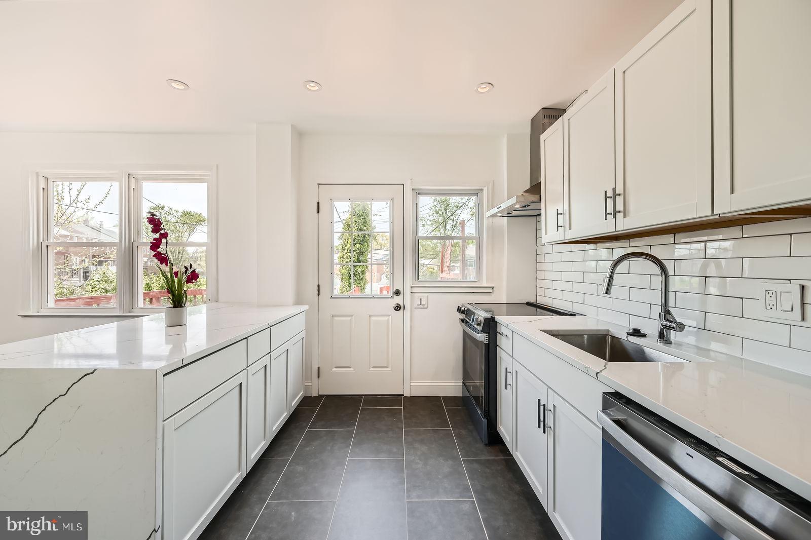 6200 Falkirk Road Baltimore, MD 21239 - Photo 11 of 27 a kitchen with sink a window and appliances