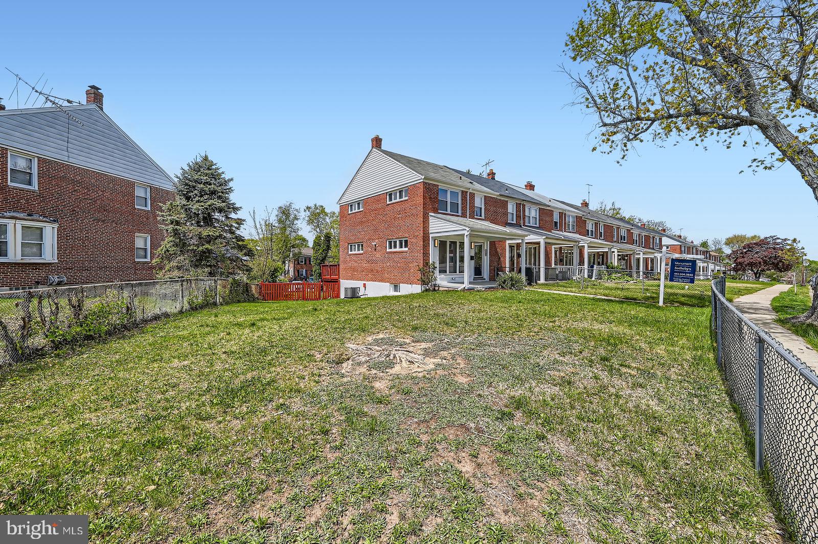 6200 Falkirk Road Baltimore, MD 21239 - Photo 2 of 27 a view of a house with backyard and a tree